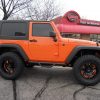 Revtek 3" Lift Kit installed on orange Jeep JK