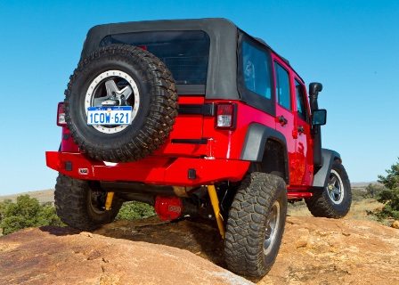OME 4 inch Lift Kit installed of a red Jeep Wrangler JK 2007-2015 back