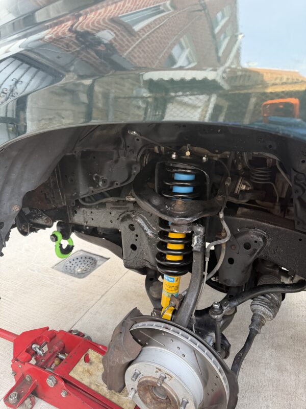 Bilstein 4600 Assembled Coilovers with OE Replacement Springs with Rear Shocks and Coils for 1996-2002 Toyota 4Runner installed - front coilover view